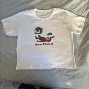 NEW Mega Yacht Curious George x Coco Chanel Cropped
Graphic Tee